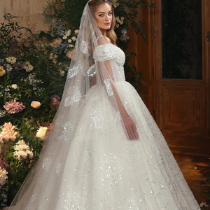 2024 Luxury Lace Ball Gown Wedding Dress with Beading and Spaghetti Straps.