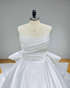 Light Effect Satin Ball Gown with Big Bow Chapel Train Pearls and Pleated Top