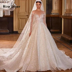 Crystal Beaded Shining Ball Gown Wedding Dress with Long Sleeves and Illusion Back