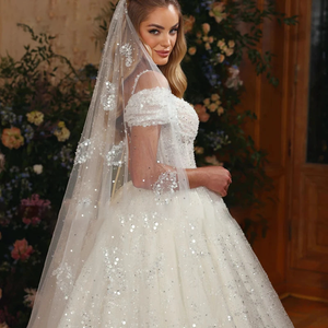 2024 Luxury Lace Ball Gown Wedding Dress with Beading and Spaghetti Straps.