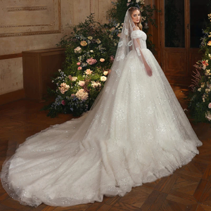 2024 Luxury Lace Ball Gown Wedding Dress with Beading and Spaghetti Straps.