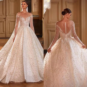 Crystal Beaded Shining Ball Gown Wedding Dress with Long Sleeves and Illusion Back