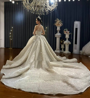 Luxury Beaded Ball Gown Wedding Dress with Long Sleeves and Elegant Detailing