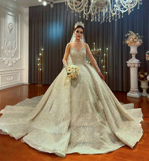 Luxury Beaded Ball Gown Wedding Dress with Long Sleeves and Elegant Detailing