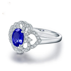 14K White Gold Flower Ring with Blue Tanzanite – December Birthstone