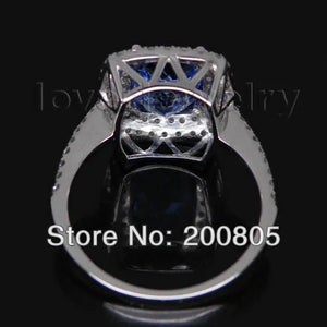 Vintage 18kt White Gold Ring with 7x10mm AAA Tanzanite and Natural Diamonds