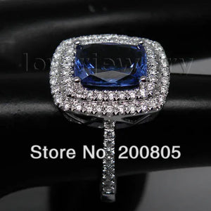 Vintage 18kt White Gold Ring with 7x10mm AAA Tanzanite and Natural Diamonds