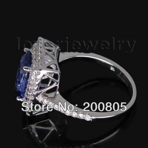 Vintage 18kt White Gold Ring with 7x10mm AAA Tanzanite and Natural Diamonds