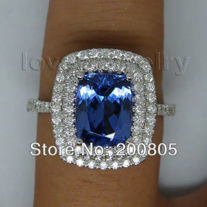 Vintage 18kt White Gold Ring with 7x10mm AAA Tanzanite and Natural Diamonds