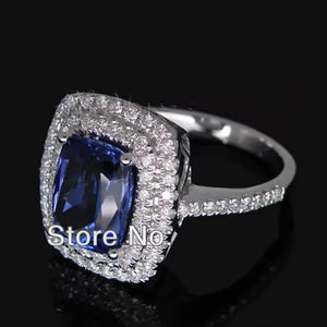 Vintage 18kt White Gold Ring with 7x10mm AAA Tanzanite and Natural Diamonds