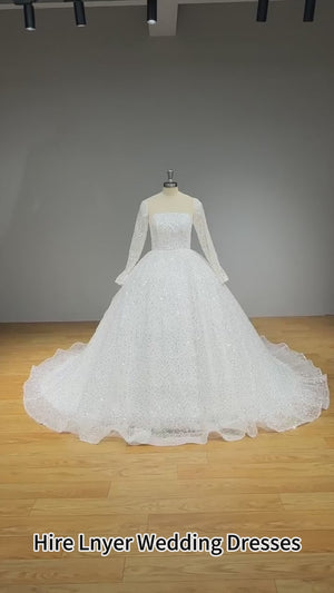 New Arrival Glitter Tulle Ball Gown Wedding Dress with Long Sleeves and Illusion Back